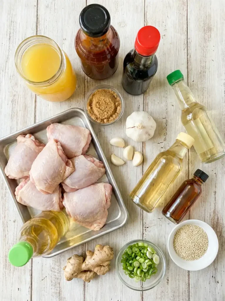  Ingredients for Hawaiian BBQ chicken marinade with pineapple juice, BBQ sauce, soy sauce, garlic, ginger, and chicken thighs